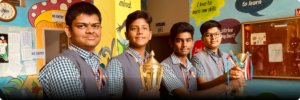 Students holding trophies at Vivekananda Residential School